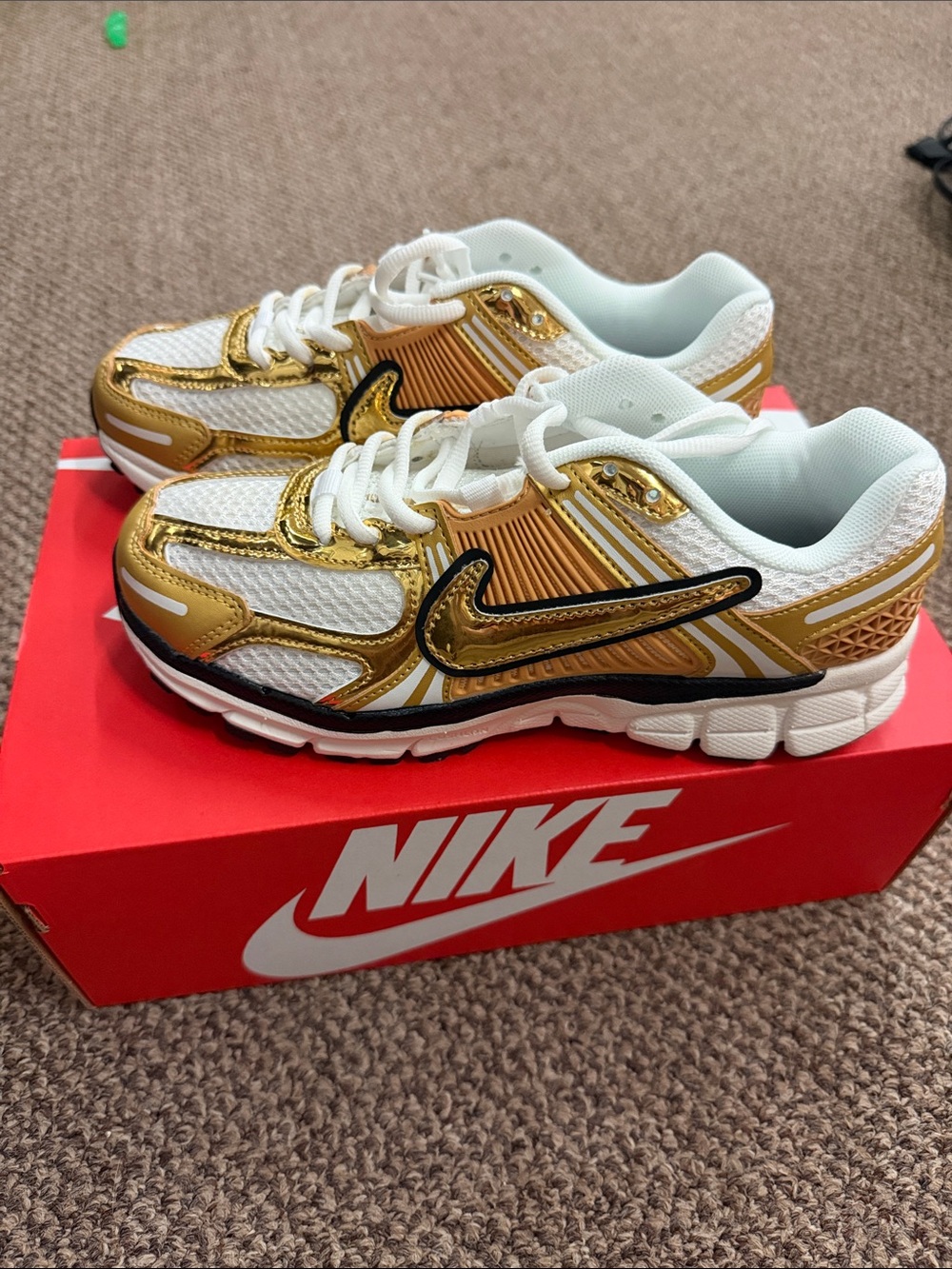 Nike White and Gold Metallic Swoosh Athletic Sneakers